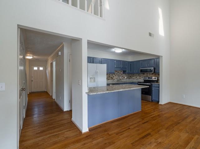 1307 Whitlock Ridge Drive Marietta, GA 30064 - Photo 9 of 29 a kitchen with stainless steel appliances granite countertop a refrigerator and a stove top oven