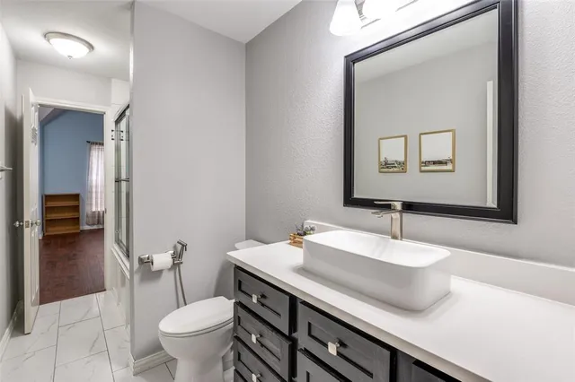 a bathroom with a sink and a toilet