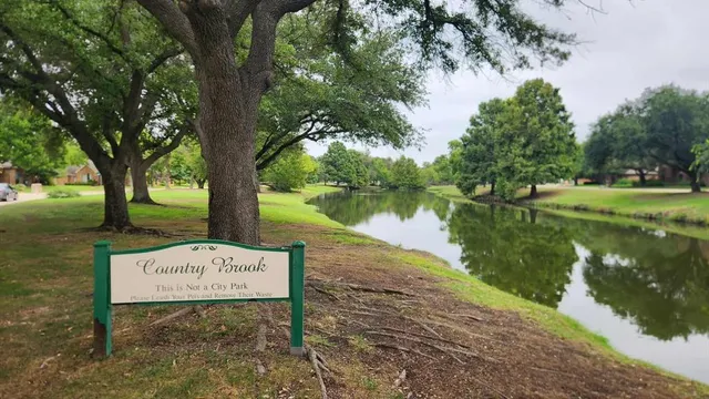 a sign on the side of the river