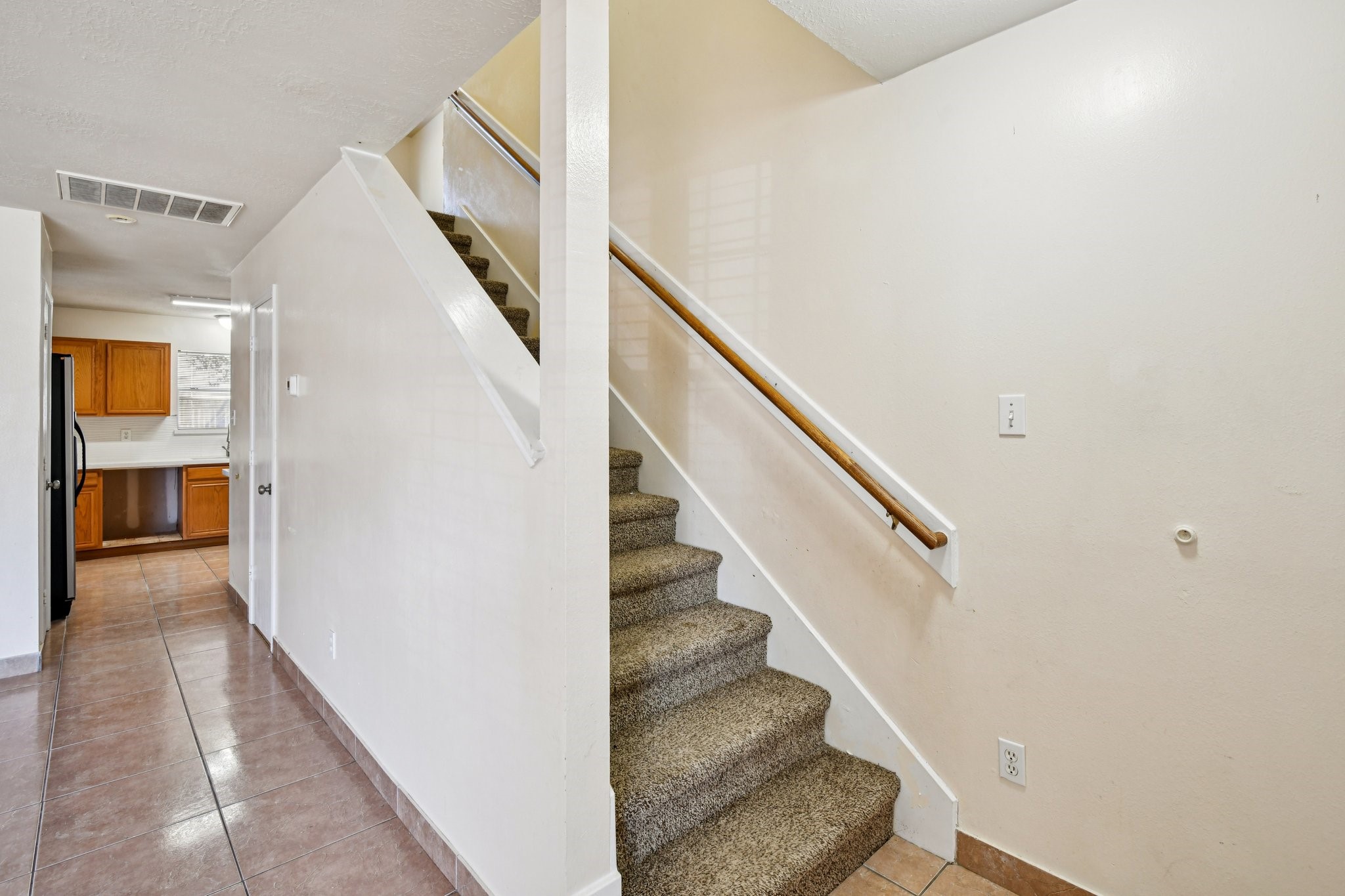 12270 Cobbs Creek Road Houston, TX 77067 - Photo 13 of 42 a view of entryway and hall with wooden floor