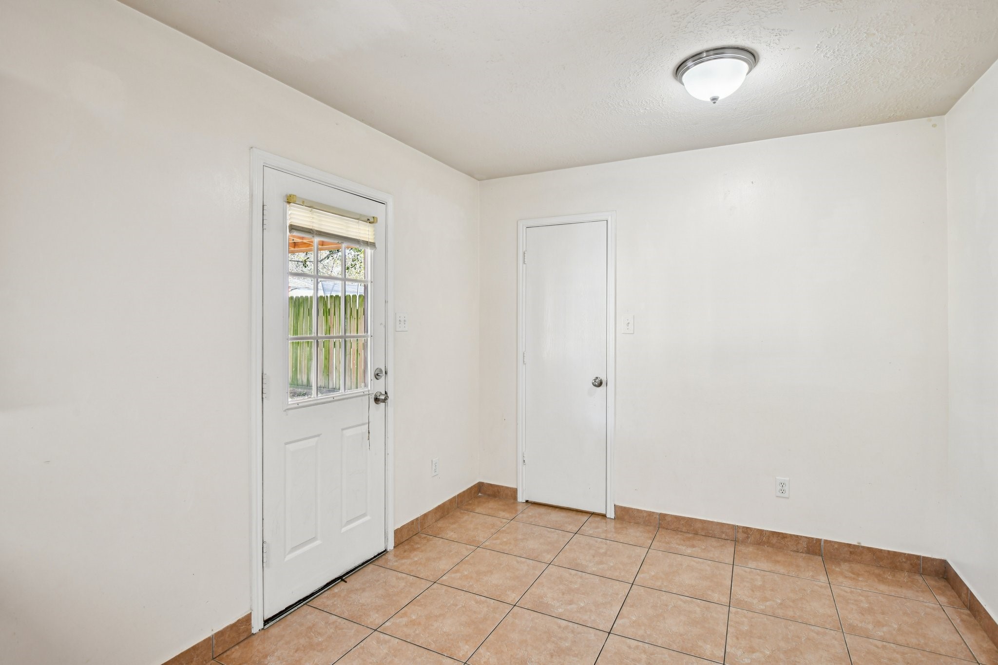 12270 Cobbs Creek Road Houston, TX 77067 - Photo 18 of 42 a view of an empty room and window