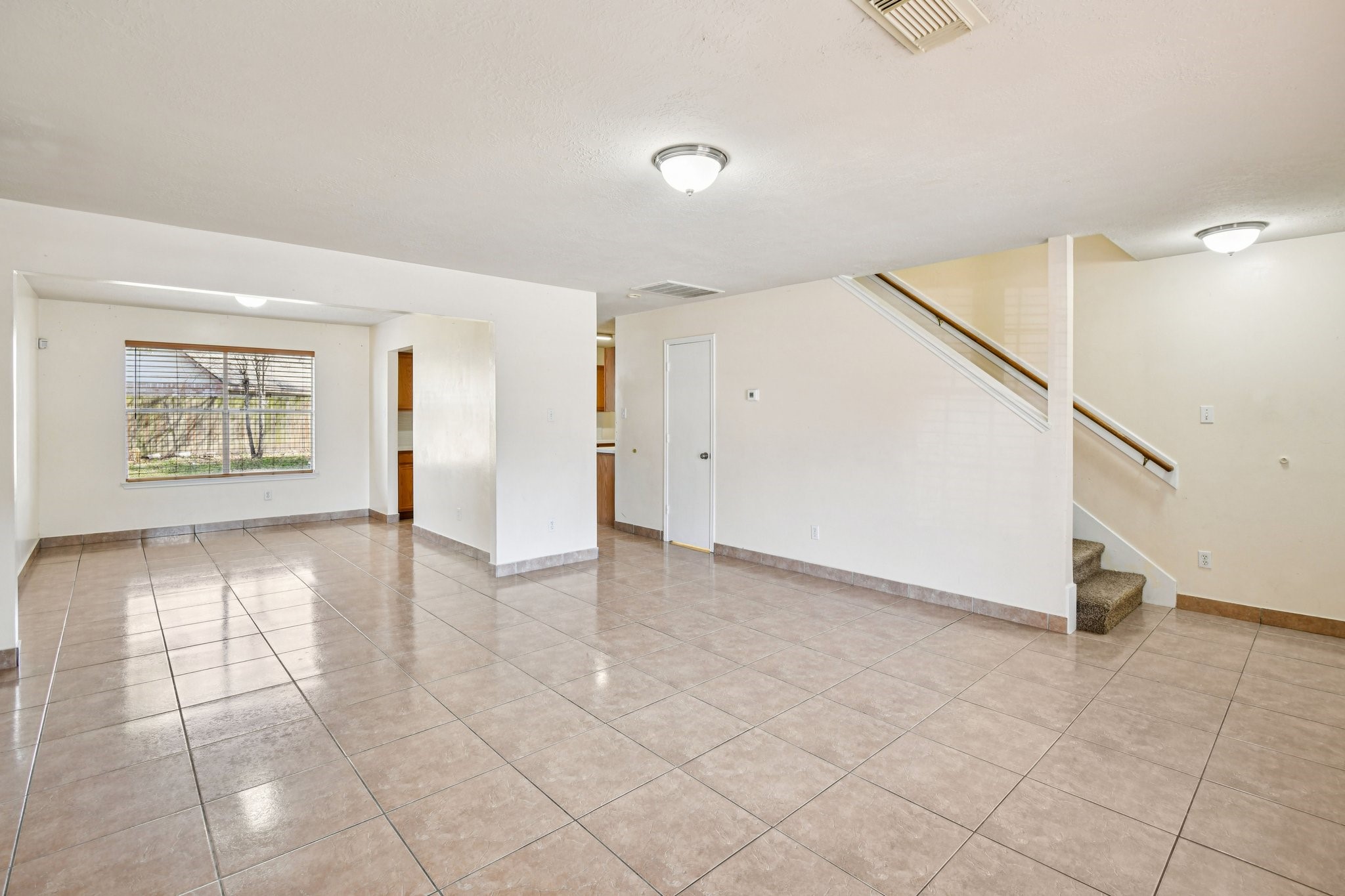 12270 Cobbs Creek Road Houston, TX 77067 - Photo 2 of 42 a view of an empty room with a window