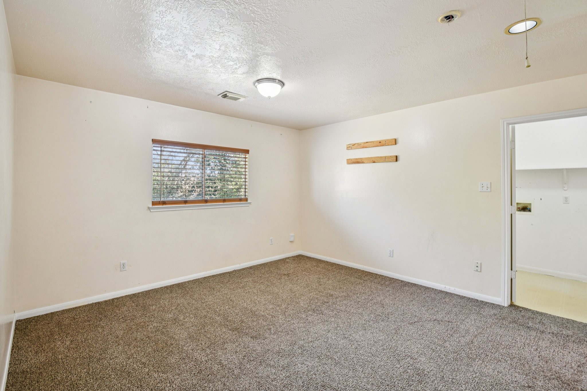 12270 Cobbs Creek Road Houston, TX 77067 - Photo 23 of 42 a view of an empty room with a window