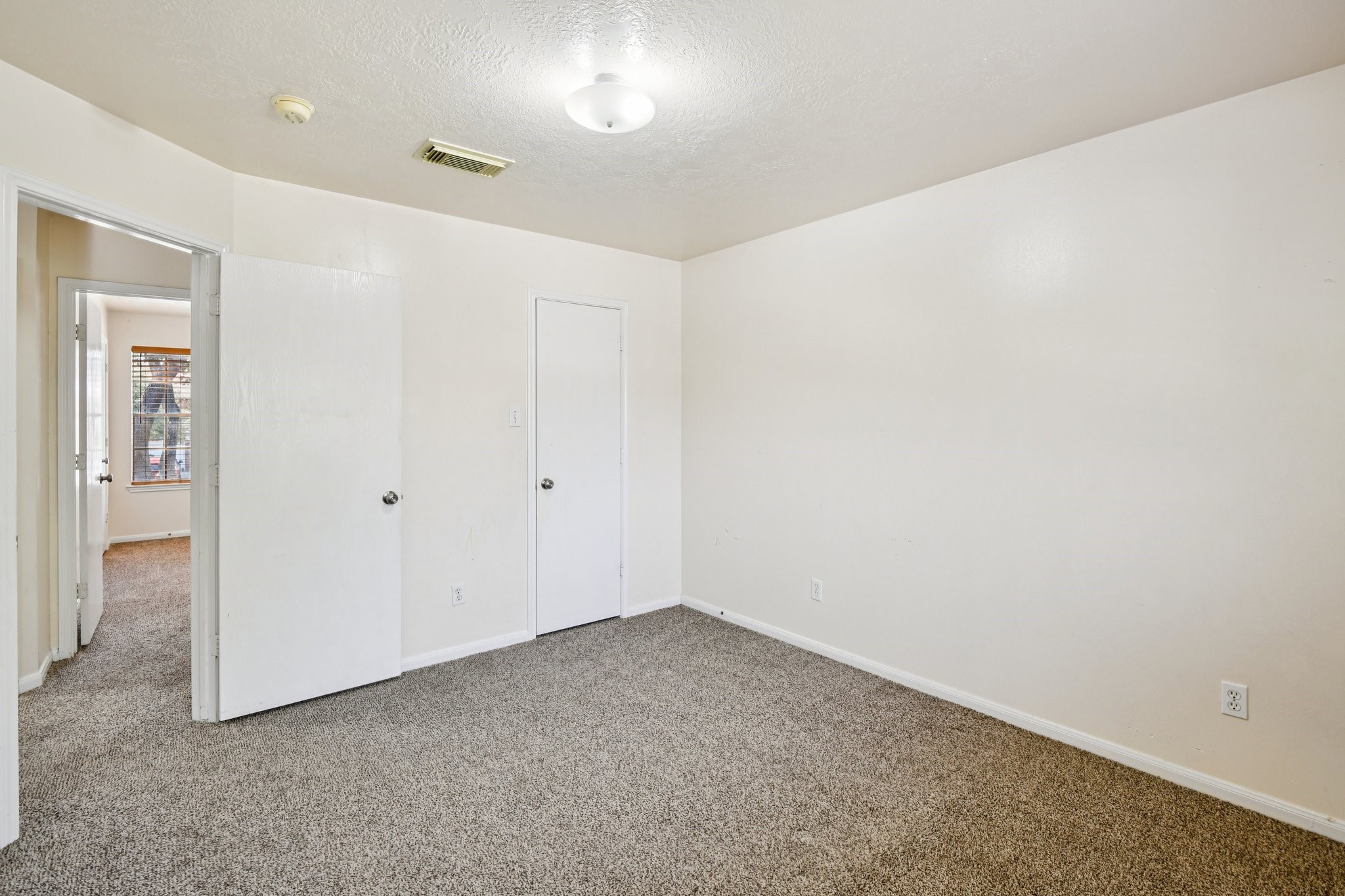 12270 Cobbs Creek Road Houston, TX 77067 - Photo 29 of 42 an empty room with entrance door