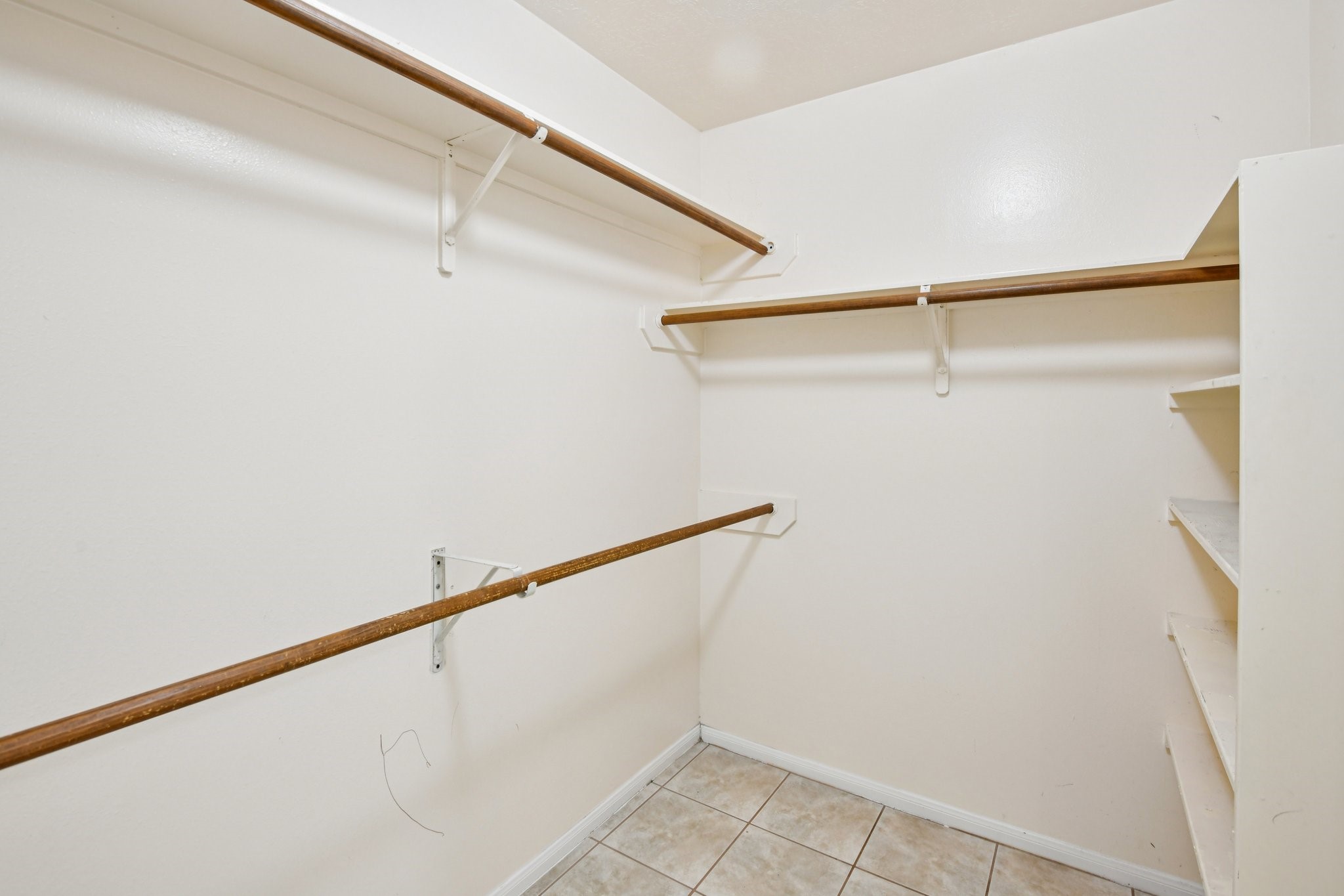 12270 Cobbs Creek Road Houston, TX 77067 - Photo 38 of 42 a view of small space with racks on the wall