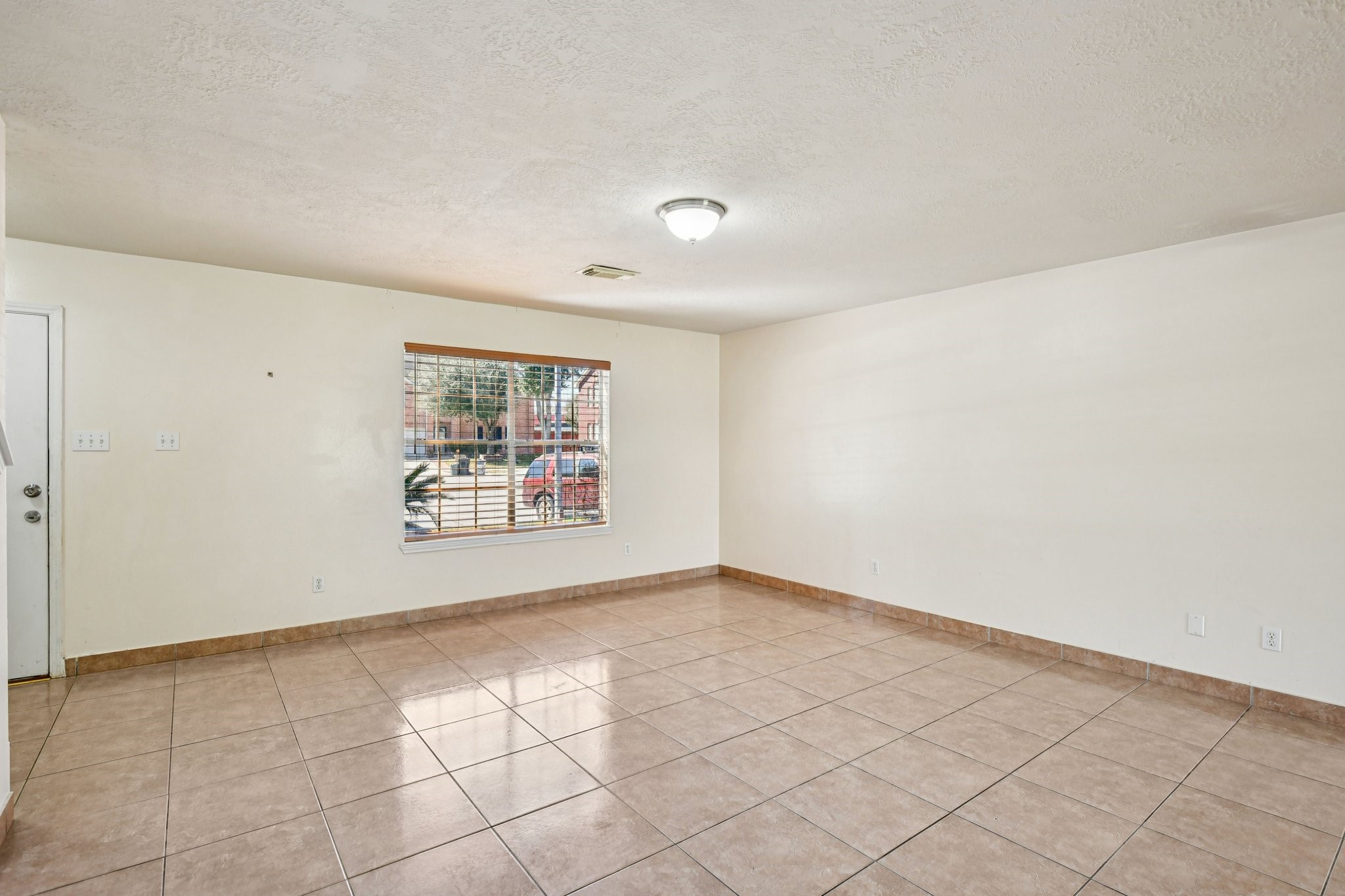12270 Cobbs Creek Road Houston, TX 77067 - Photo 9 of 42 an empty room with windows