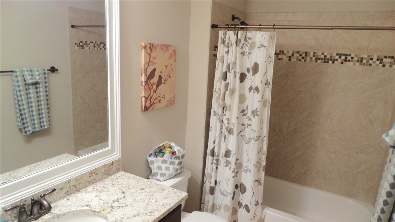 1308 Trinity Circle Raleigh, NC 27607 - Photo 16 of 25 And Full Bath #3 also has a custom-tiled bath tub/shower, and a granite countertop. Bathroom