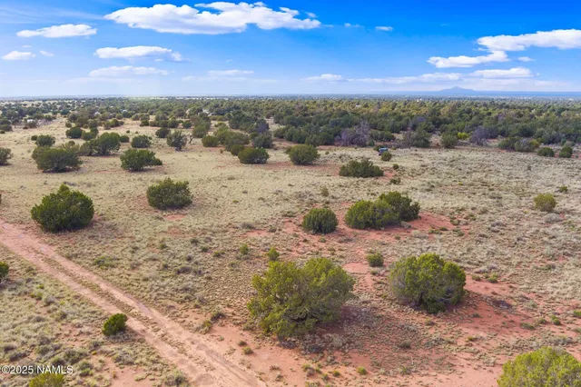 a view of balcony with yard