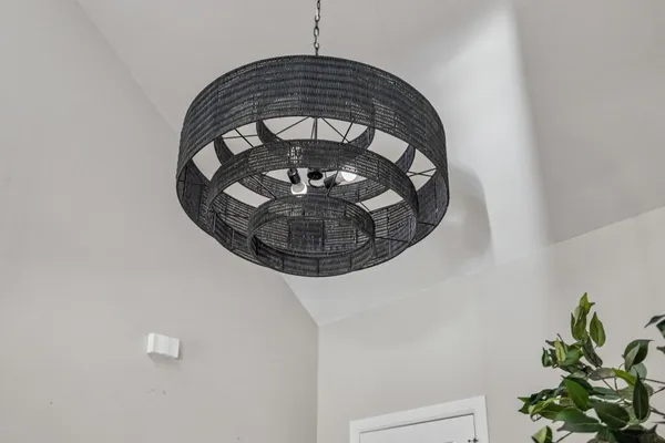 a dining room with kitchen island stainless steel appliances furniture a dining table and chairs
