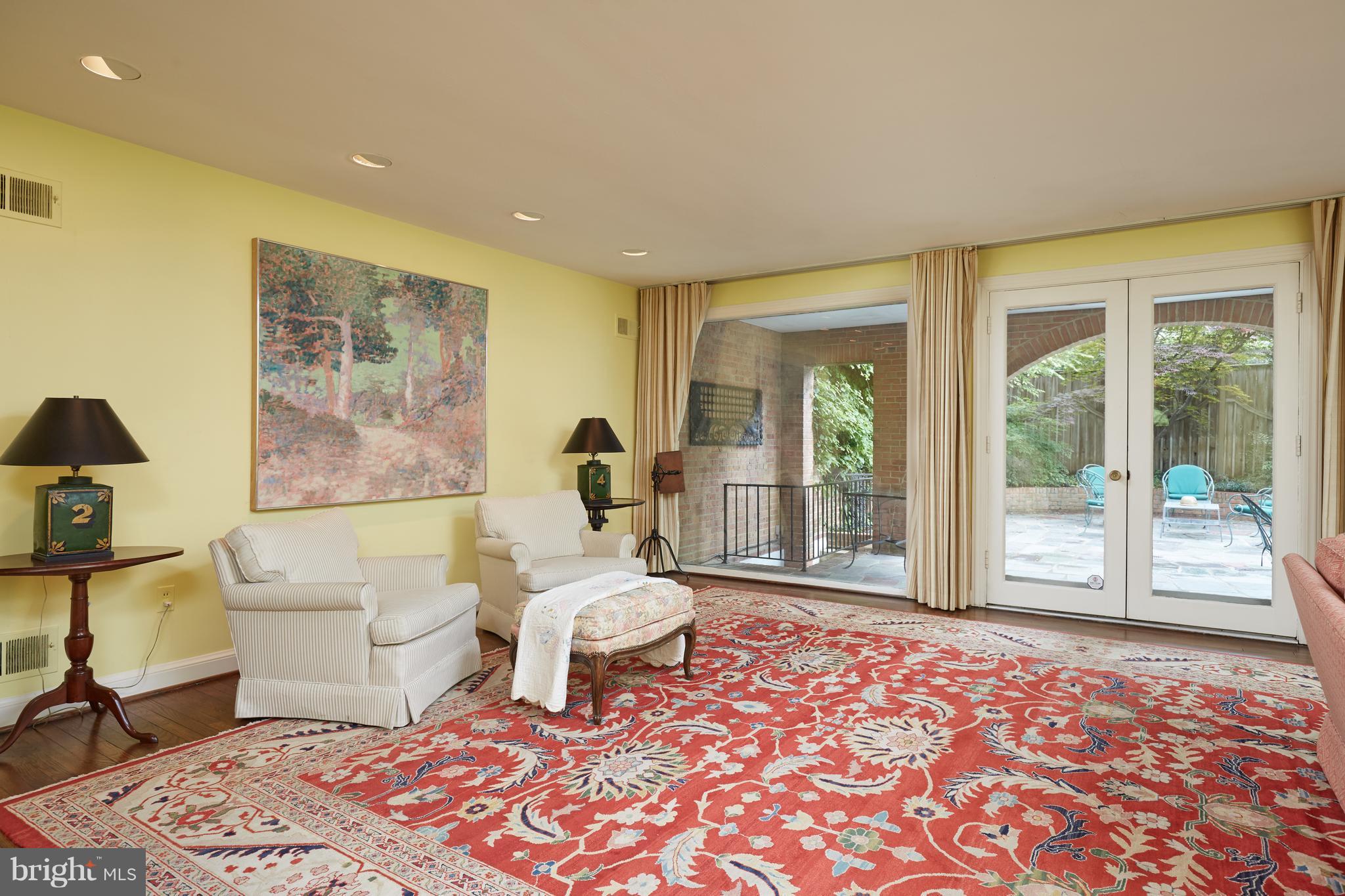 3033 West Ln Keys Northwest Washington, DC 20007 - Photo 16 of 30 a living room with a couch and next to a window