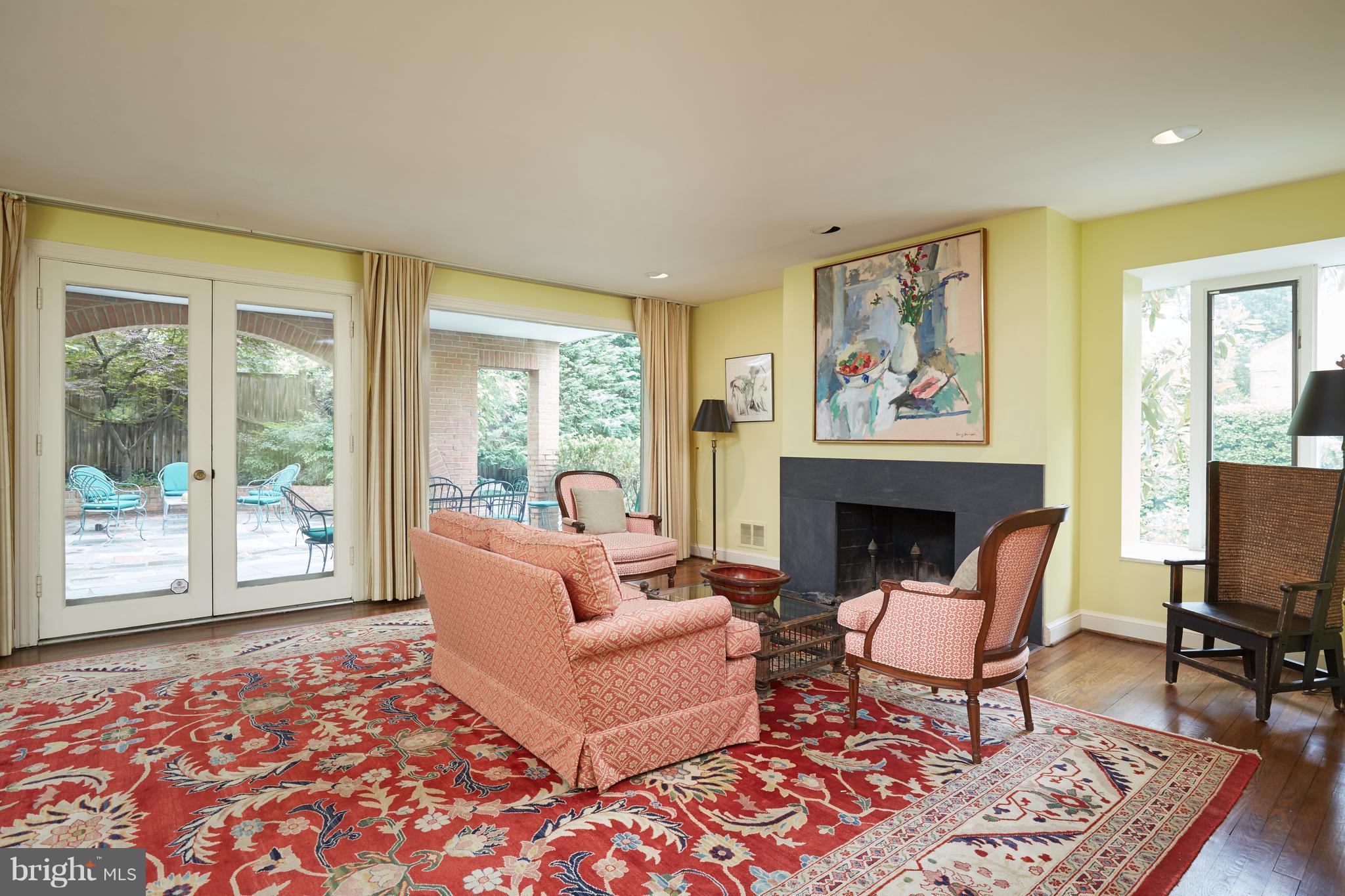 3033 West Ln Keys Northwest Washington, DC 20007 - Photo 17 of 30 a living room with furniture and a fireplace