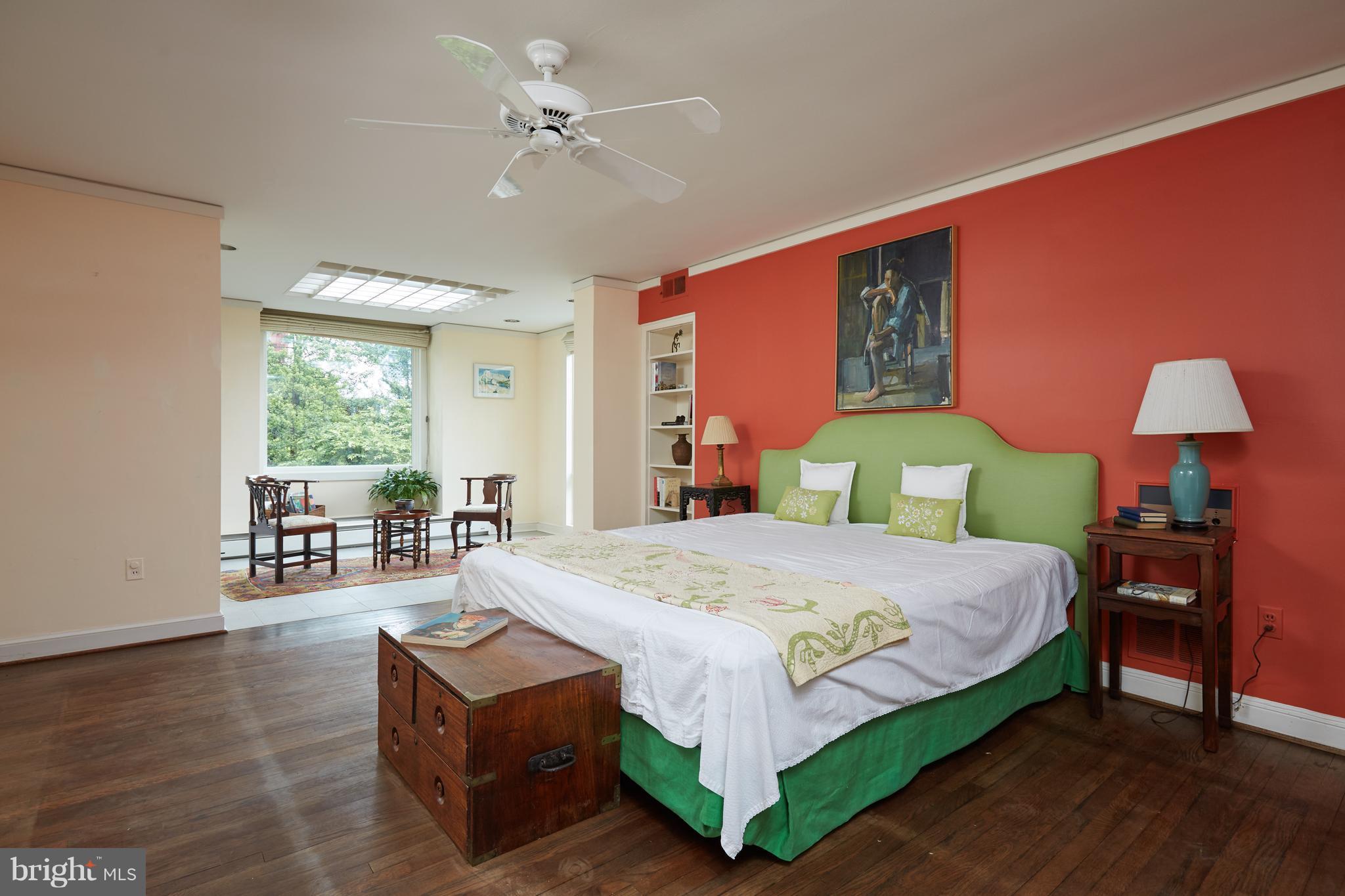 3033 West Ln Keys Northwest Washington, DC 20007 - Photo 21 of 30 a bedroom with a bed and dresser with wooden floor
