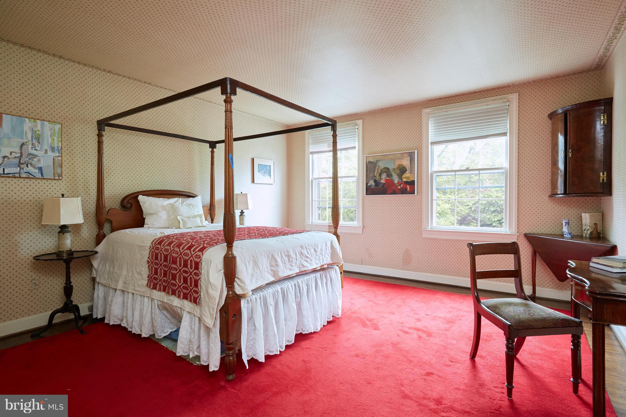 3033 West Ln Keys Northwest Washington, DC 20007 - Photo 24 of 30 a bedroom with a bed table chair and a window