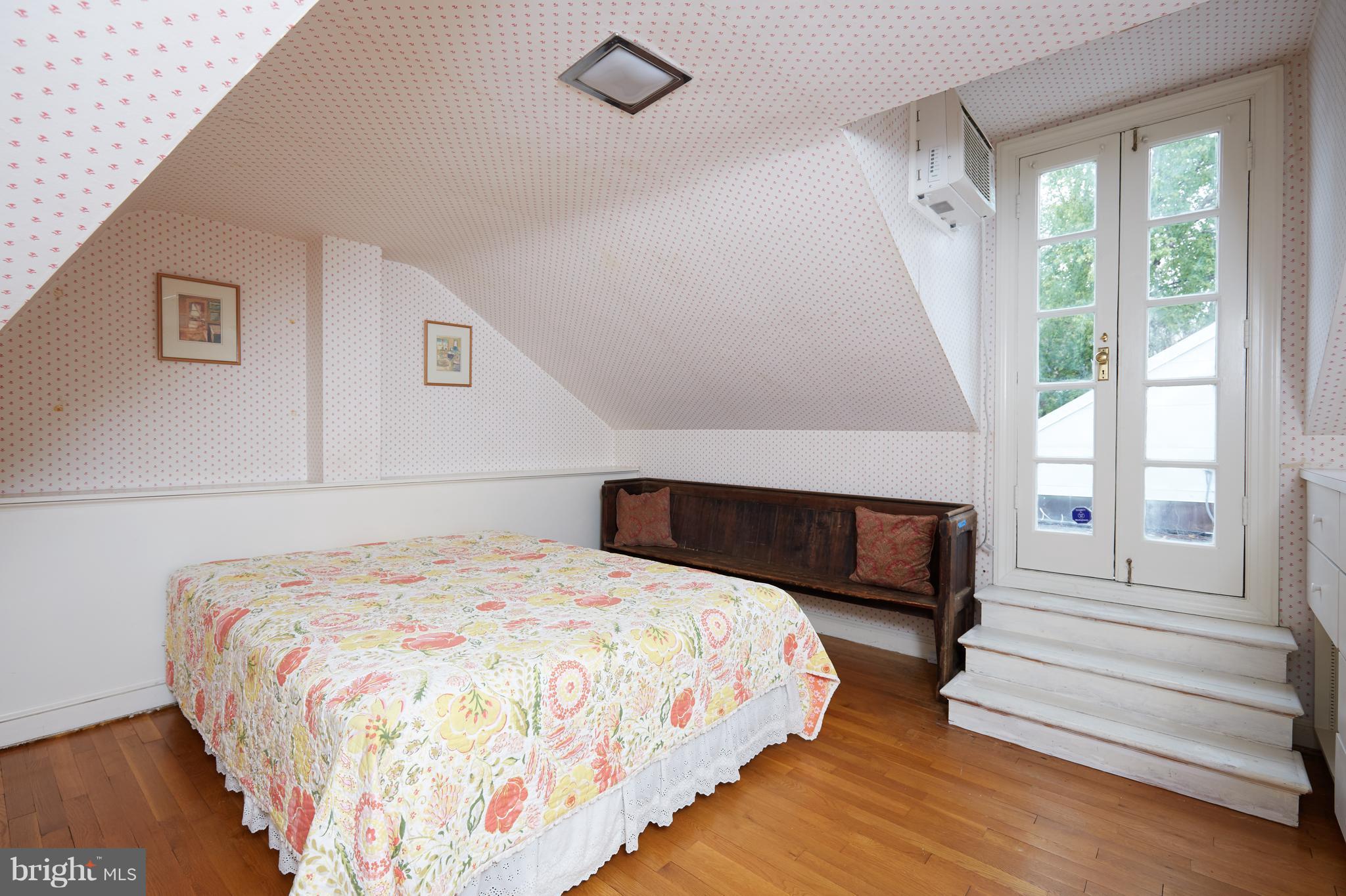 3033 West Ln Keys Northwest Washington, DC 20007 - Photo 25 of 30 a bedroom with a bed and a large window