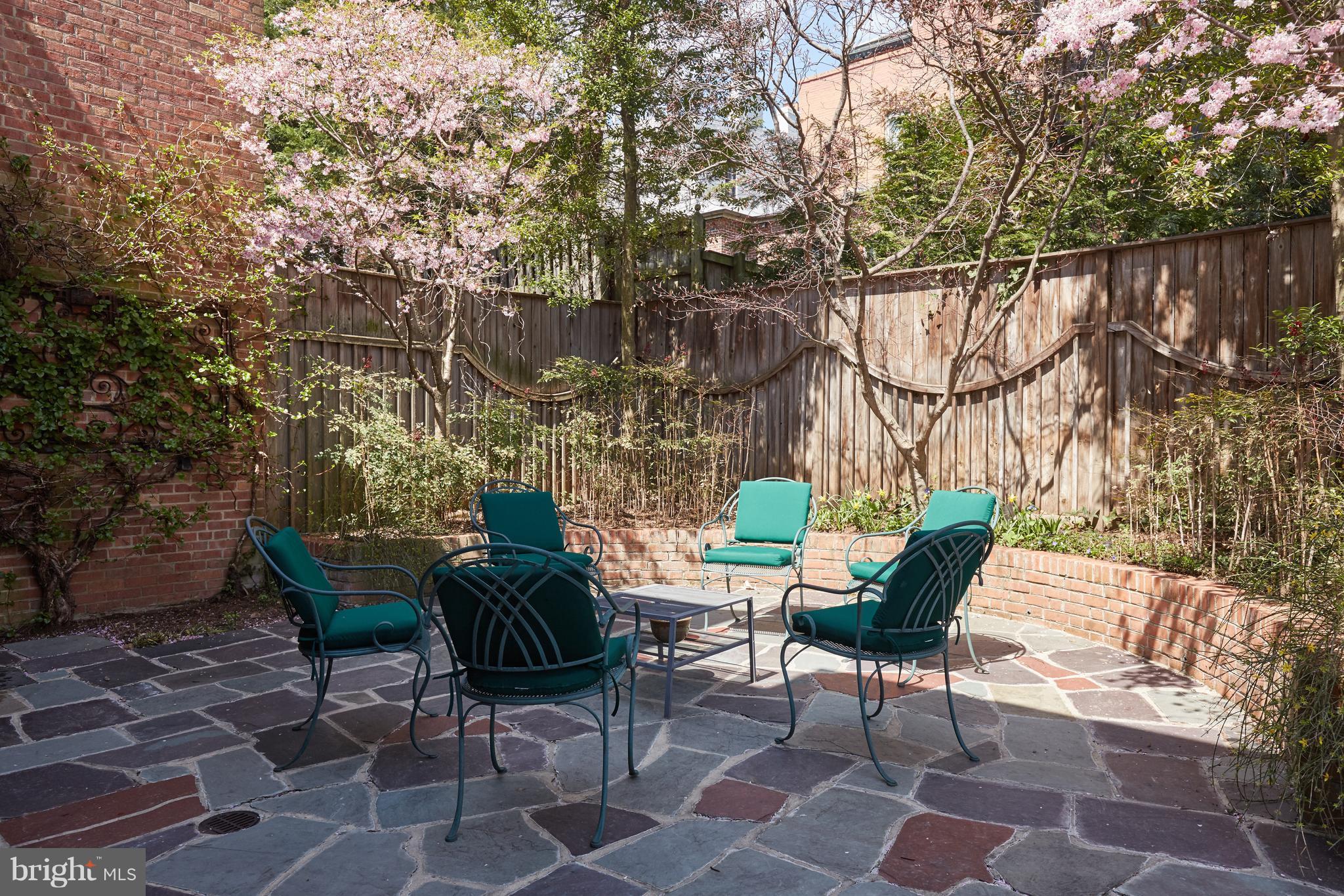 3033 West Ln Keys Northwest Washington, DC 20007 - Photo 8 of 30 a view of a chairs and table in backyard