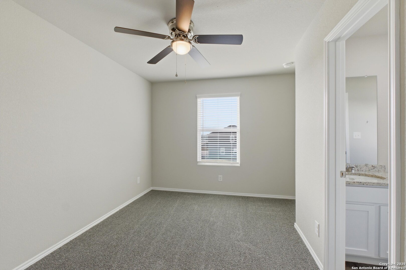 514 Abigail Alley San Antonio, TX 78253 - Photo 8 of 17 an empty room with a window and a fan