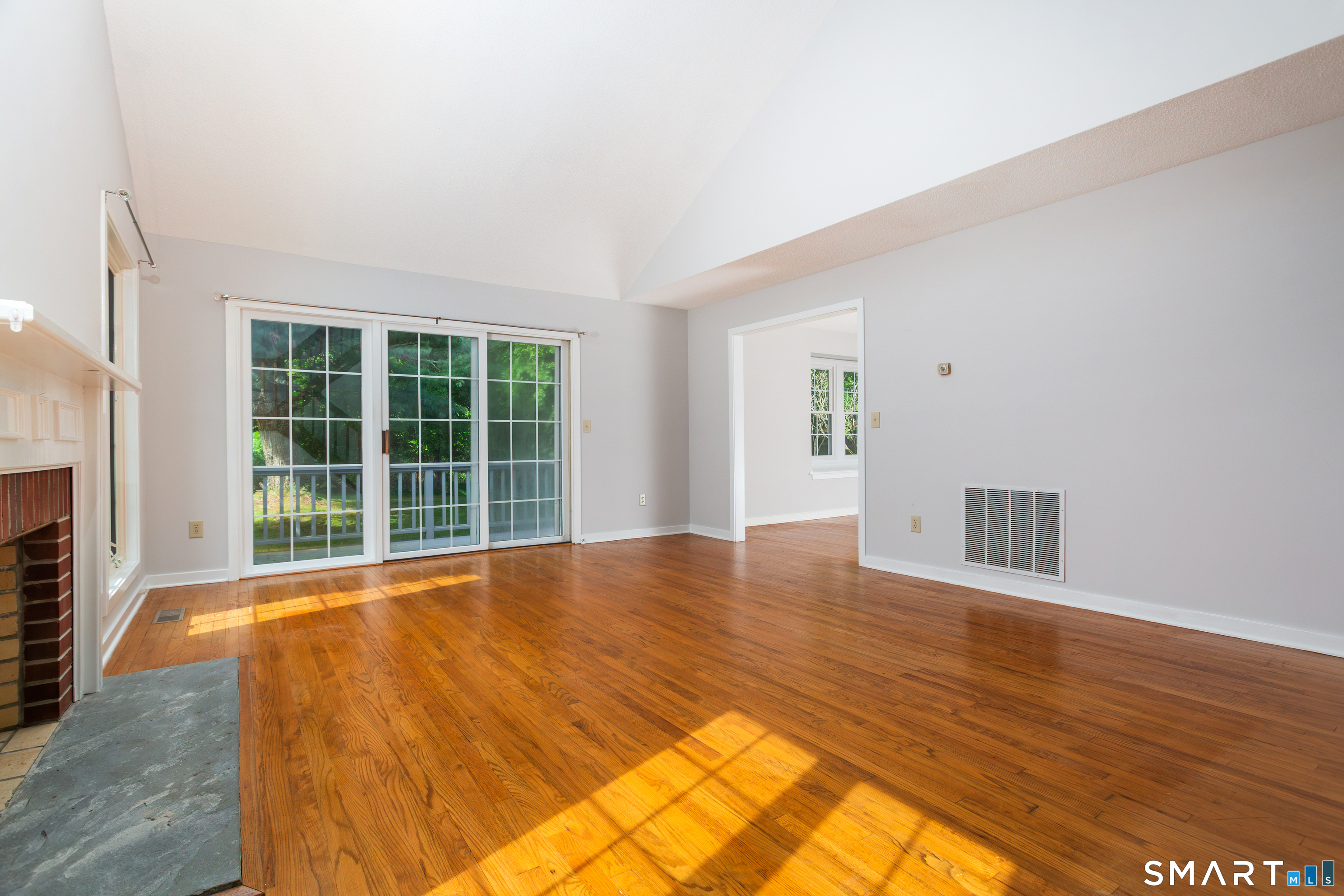 170 Glengarry Road, Unit 170 Fairfield, CT 06825 - Photo 5 of 36 Living Room with Slider to Private Deck