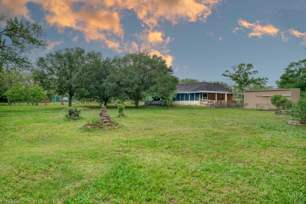 308 County Road 893B Angleton, TX 77515 - Photo 41 of 41 a view of a house with a yard