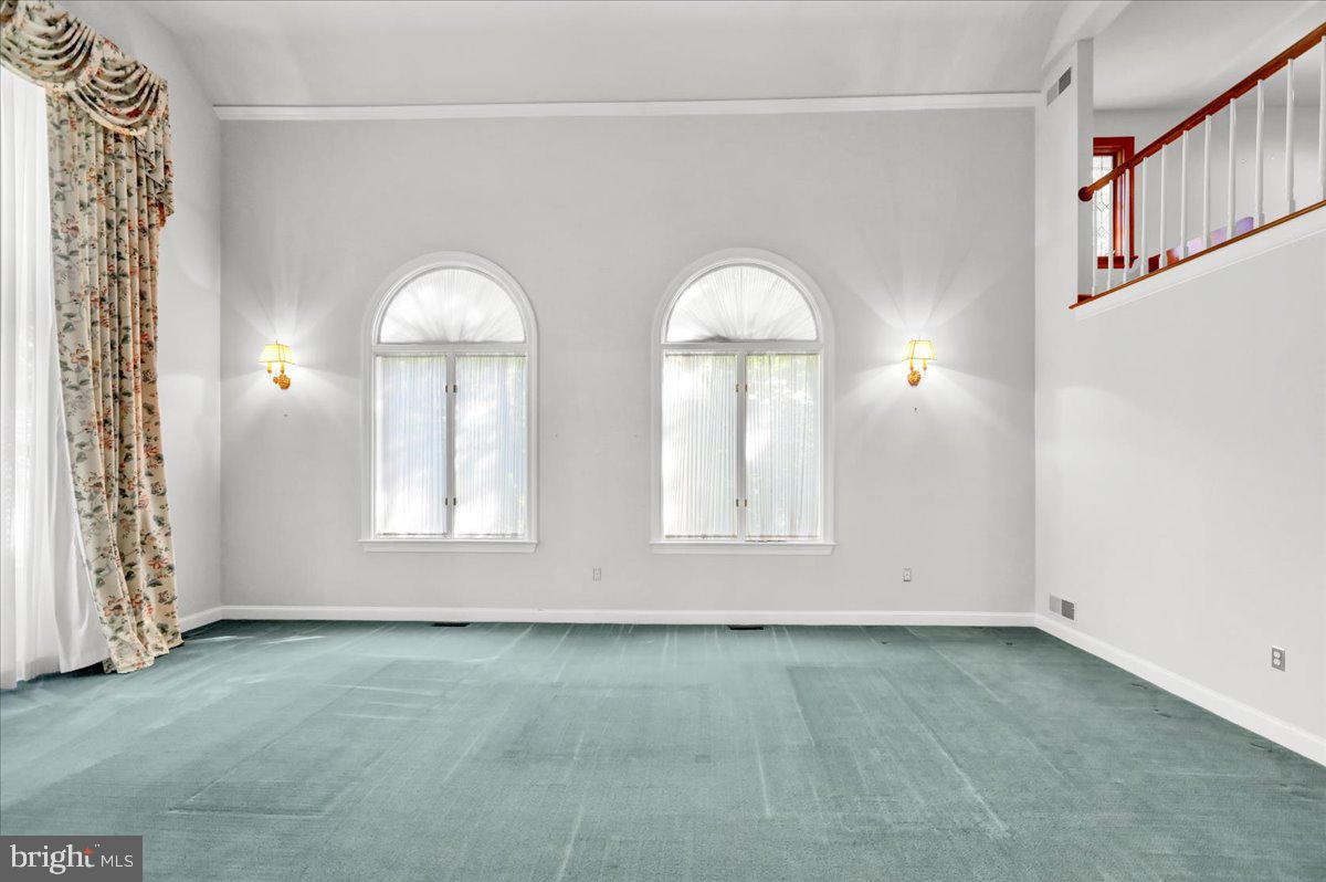 34 Hessian Boulevard Reading, PA 19607 - Photo 16 of 69 an empty room with windows and chandelier