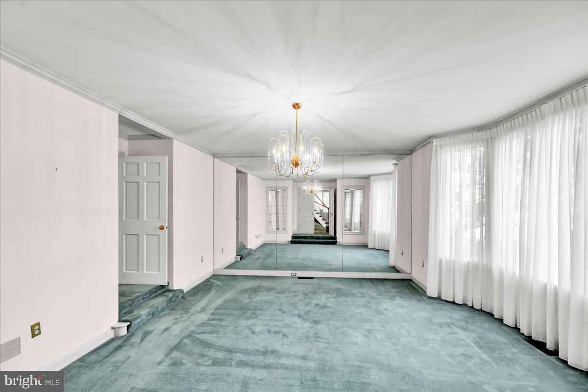 34 Hessian Boulevard Reading, PA 19607 - Photo 22 of 69 a view of a livingroom with a chandelier fan and windows
