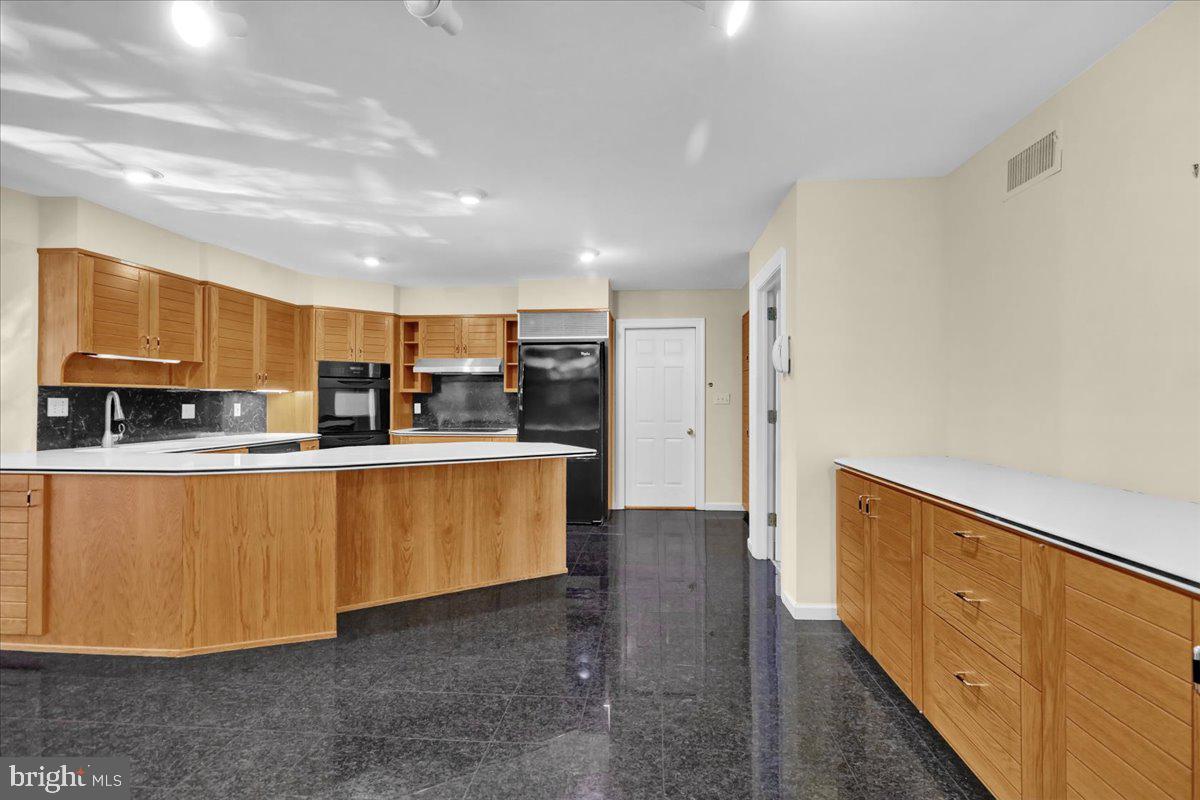 34 Hessian Boulevard Reading, PA 19607 - Photo 28 of 69 a kitchen with stainless steel appliances granite countertop a refrigerator and a stove top oven