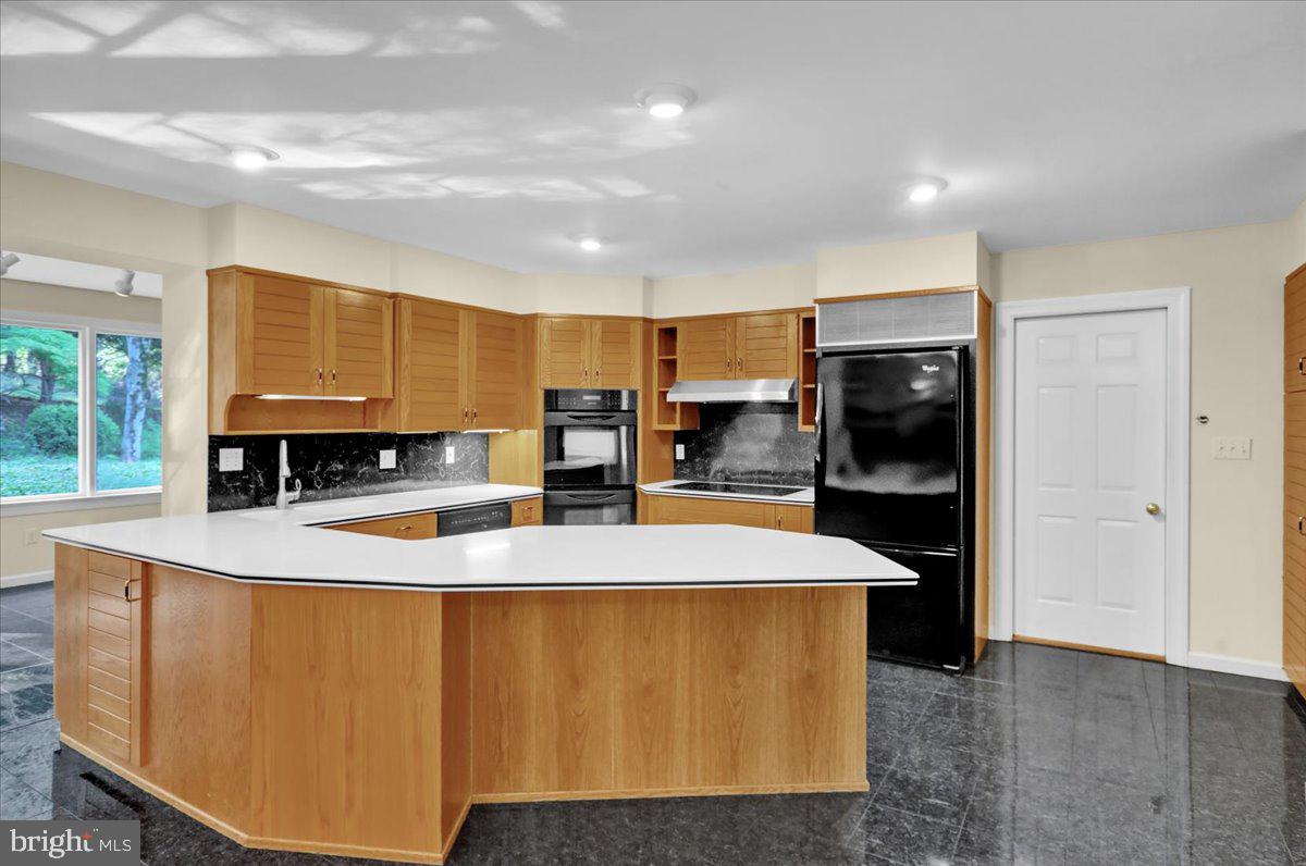 34 Hessian Boulevard Reading, PA 19607 - Photo 29 of 69 a large kitchen with stainless steel appliances a refrigerator a sink a stove and wooden cabinets