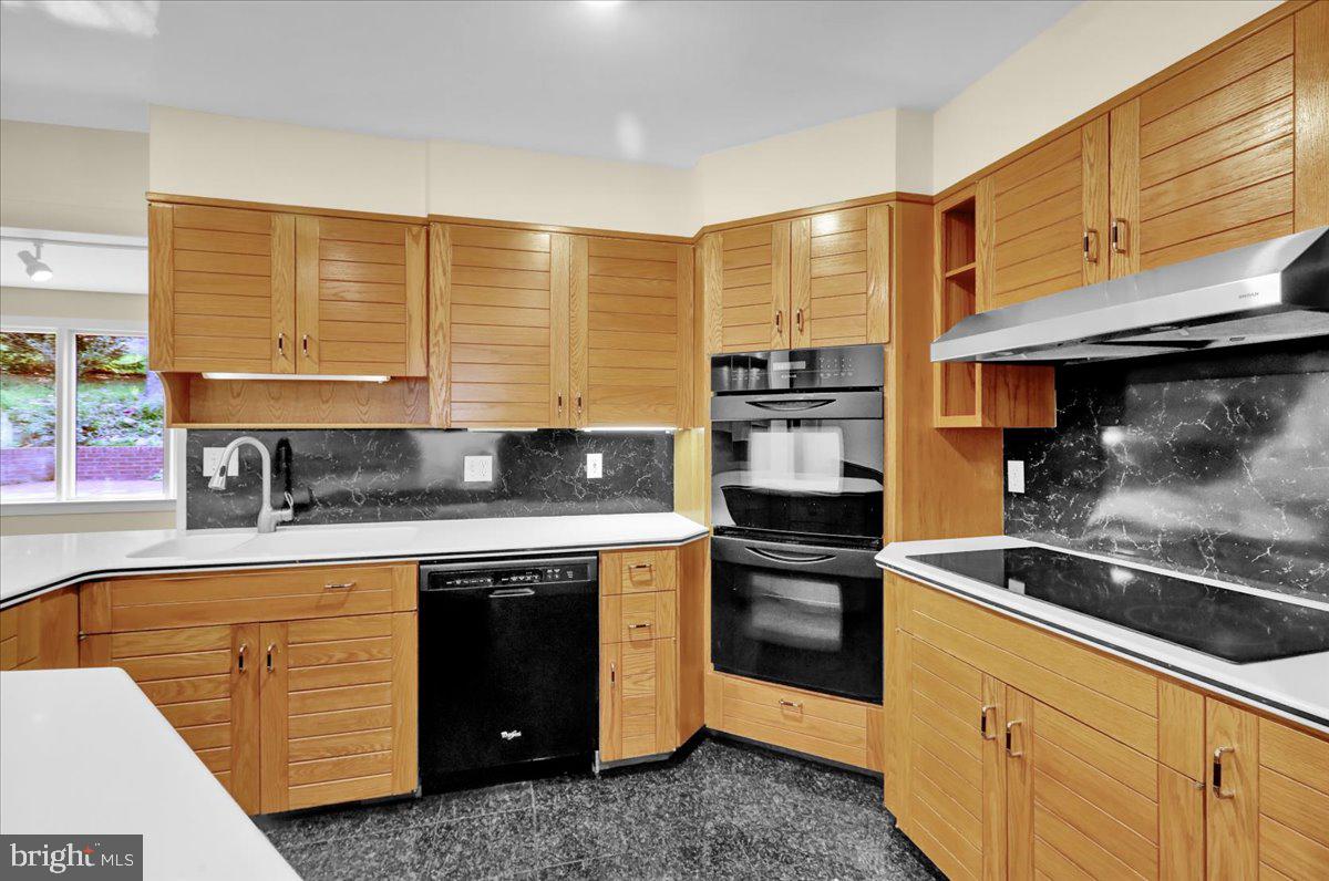 34 Hessian Boulevard Reading, PA 19607 - Photo 30 of 69 a kitchen with stainless steel appliances granite countertop a sink a stove and a refrigerator