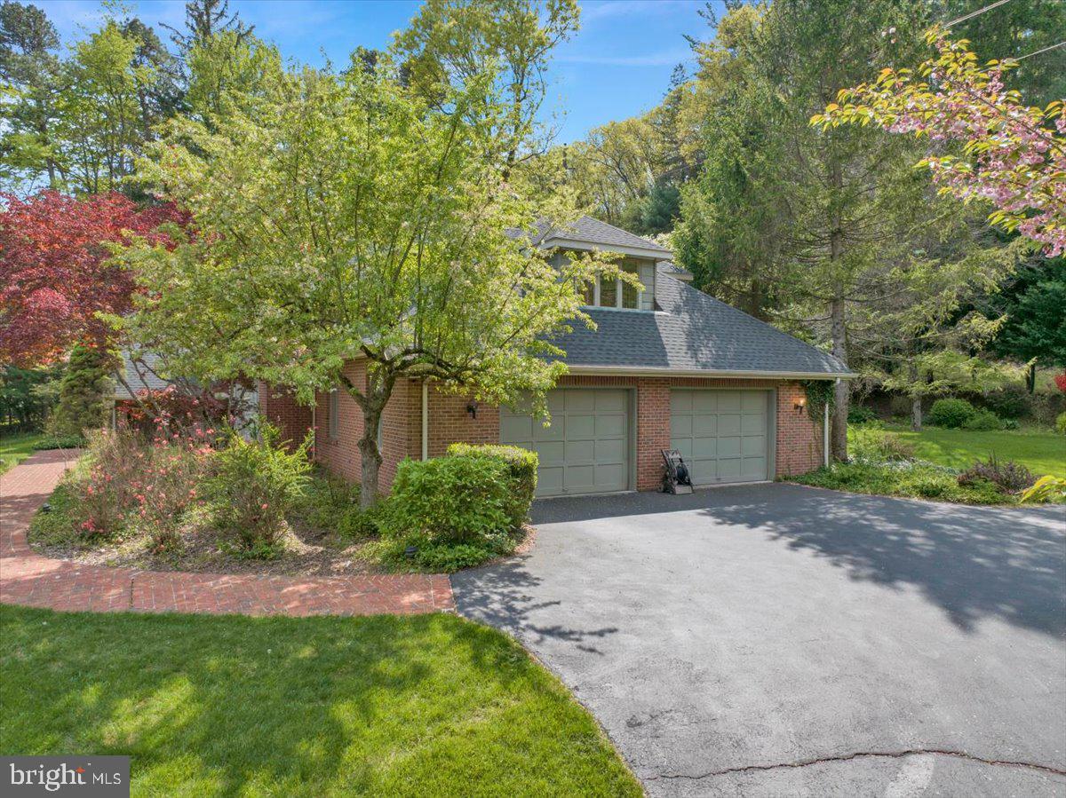 34 Hessian Boulevard Reading, PA 19607 - Photo 6 of 69 a front view of a house with a yard and garage