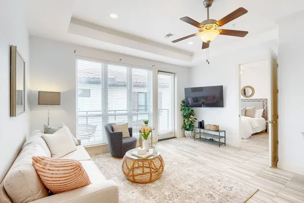 a living room with furniture and a large window