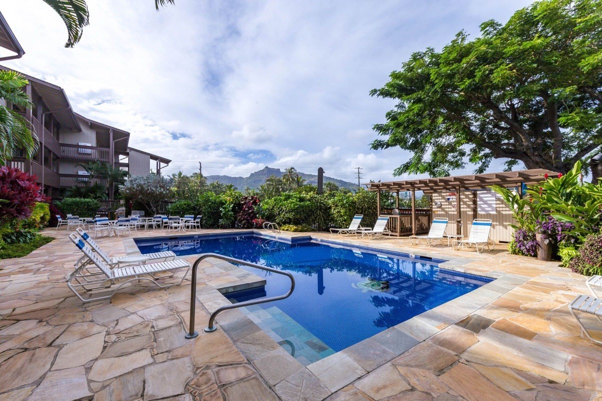 320 Papaloa Road, Unit 213 Kapaa, HI 96746 - Photo 23 of 25 a swimming pool with outdoor seating and yard