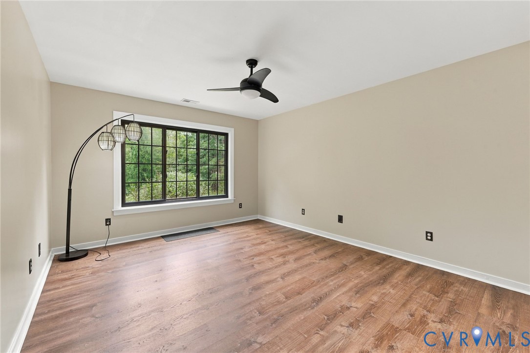133 Ford Road Bumpass, VA 23024 - Photo 19 of 55 Wood-finish flooring, large window with black fram