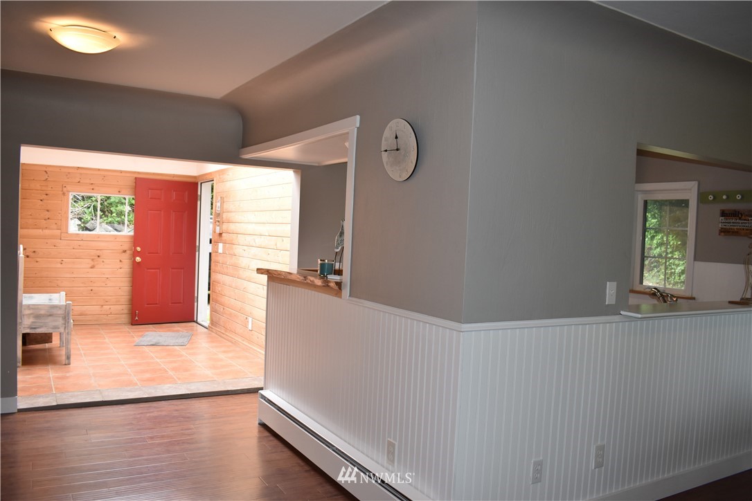 10411 Northeast West Kingston Road Kingston, WA 98346 - Photo 13 of 31 a view of hallway with wooden floor