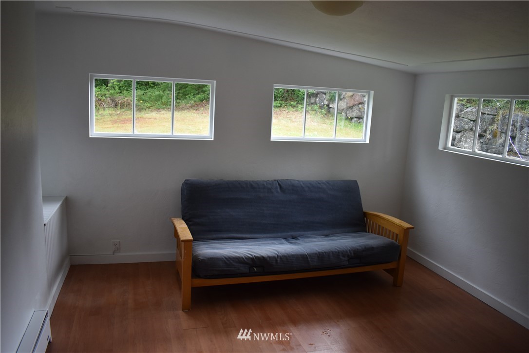 10411 Northeast West Kingston Road Kingston, WA 98346 - Photo 21 of 31 a view of a livingroom with furniture and a window