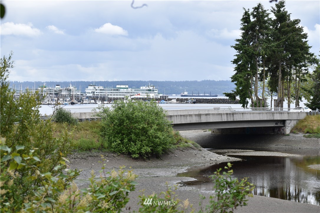 10411 Northeast West Kingston Road Kingston, WA 98346 - Photo 27 of 31 a view of a lake with a city