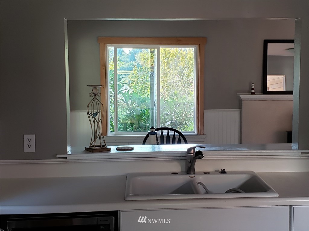 10411 Northeast West Kingston Road Kingston, WA 98346 - Photo 8 of 31 a view of sink with a potted plant and a window