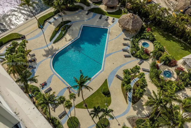 an aerial view of a backyard with garden