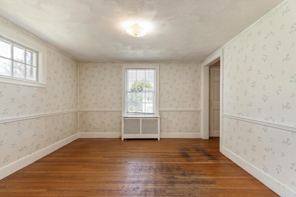 8 Florence Road Waltham, MA 02453 - Photo 11 of 33 an empty room with wooden floor and windows