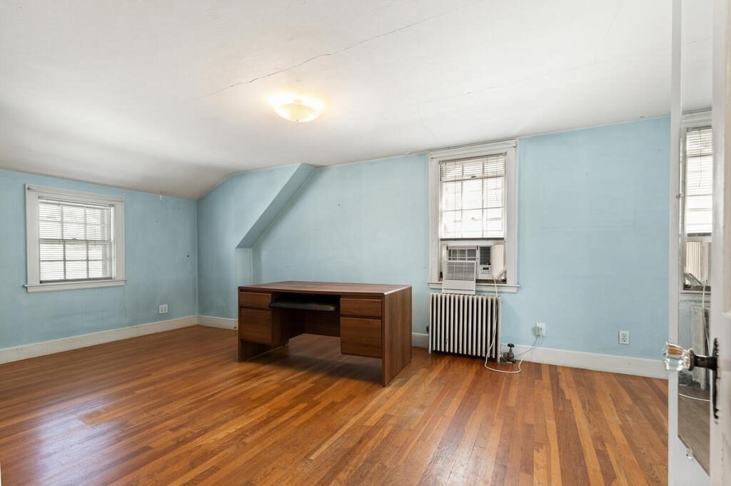 8 Florence Road Waltham, MA 02453 - Photo 16 of 33 an empty room with wooden floor and windows