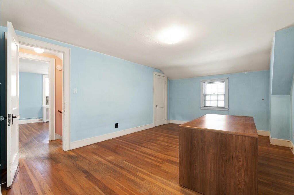 8 Florence Road Waltham, MA 02453 - Photo 17 of 33 a view of empty room with wooden floor and fan