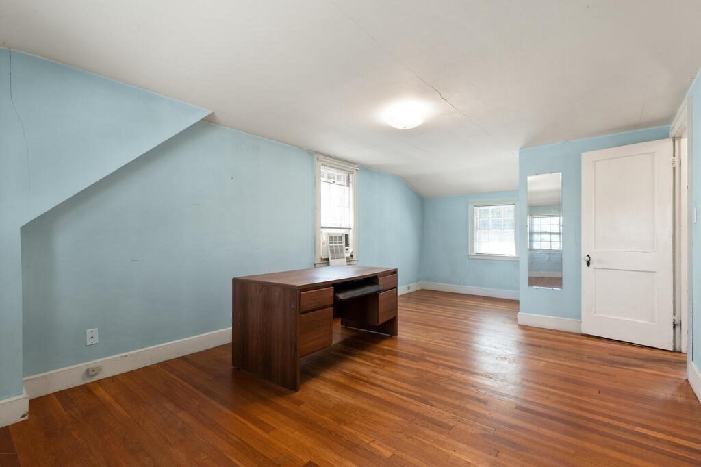 8 Florence Road Waltham, MA 02453 - Photo 18 of 33 an empty room with wooden floor and window