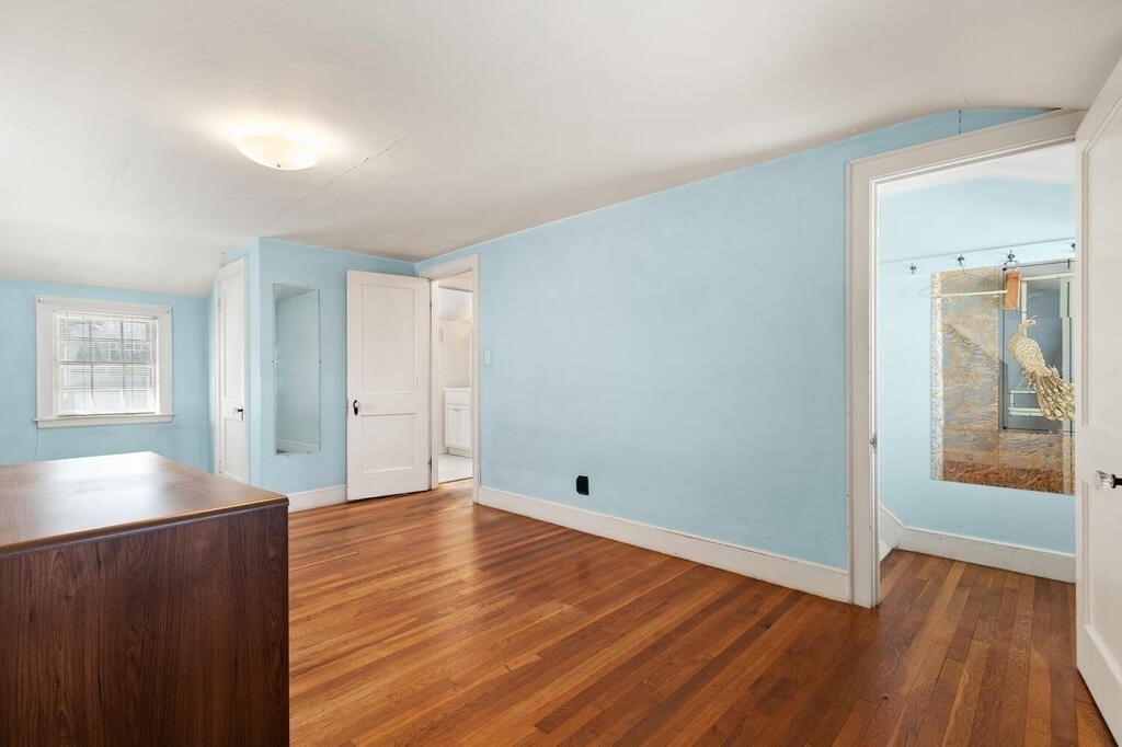 8 Florence Road Waltham, MA 02453 - Photo 19 of 33 wooden floor in an empty room with a window