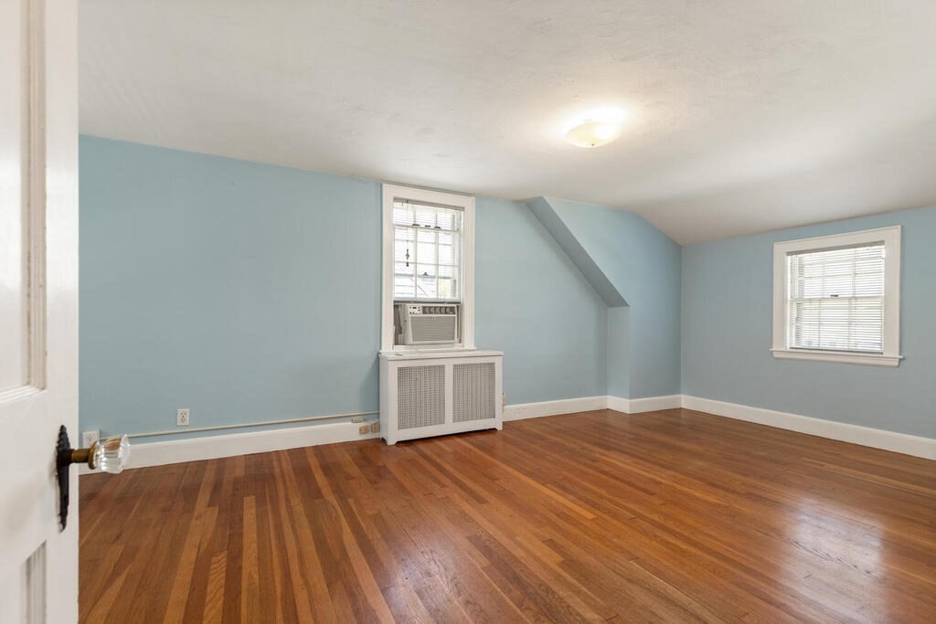 8 Florence Road Waltham, MA 02453 - Photo 20 of 33 an empty room with wooden floor cabinet and windows