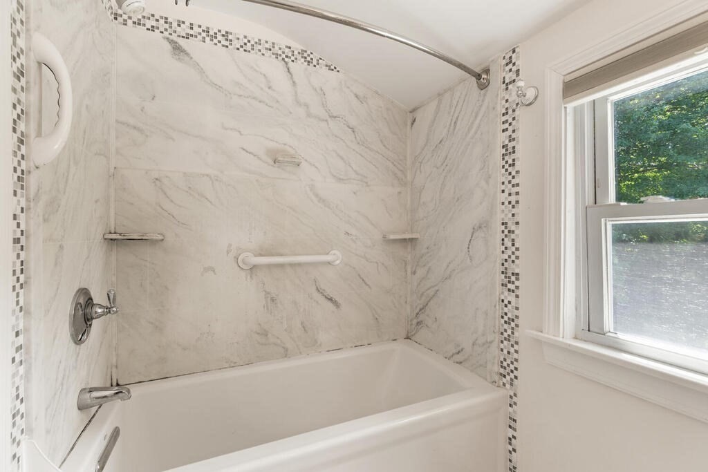 8 Florence Road Waltham, MA 02453 - Photo 24 of 33 a bathroom with a shower and a bathtub