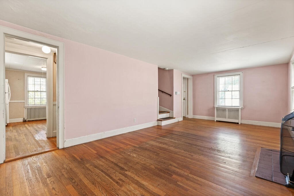 8 Florence Road Waltham, MA 02453 - Photo 7 of 33 an empty room with wooden floor and windows