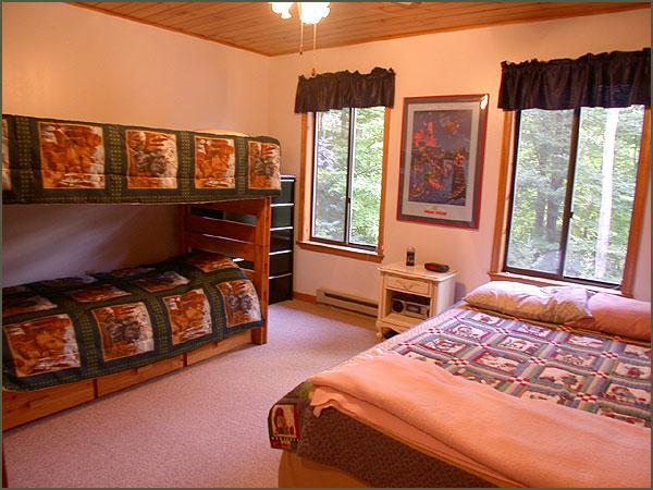 1905 Fawn Road Pocono Lake, PA 18347 - Photo 8 of 10 a bedroom with bed and wooden floor