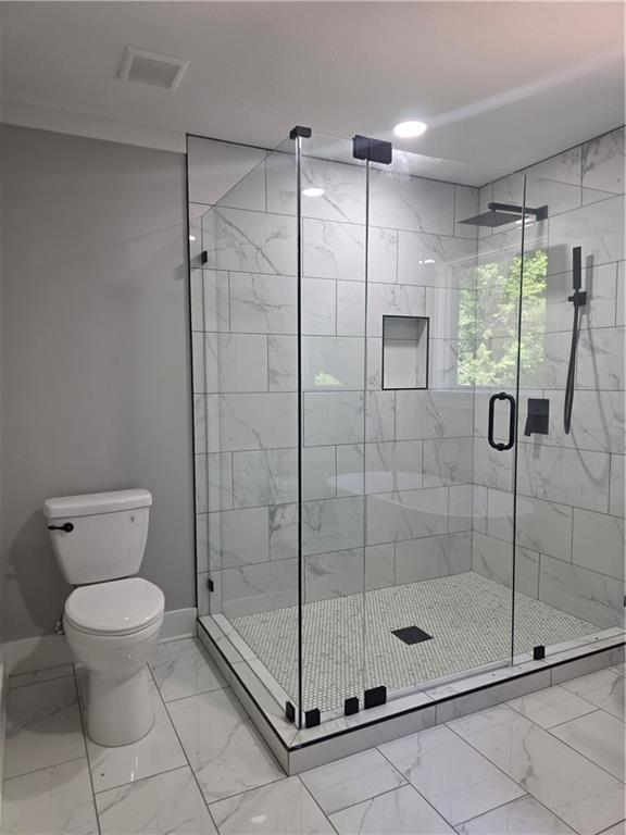 1217 Youngs Farm Road Cedartown, GA 30125 - Photo 23 of 29 a bathroom with a shower a toilet and a sink