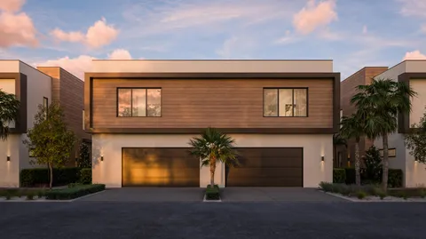 an aerial view of residential building with parking