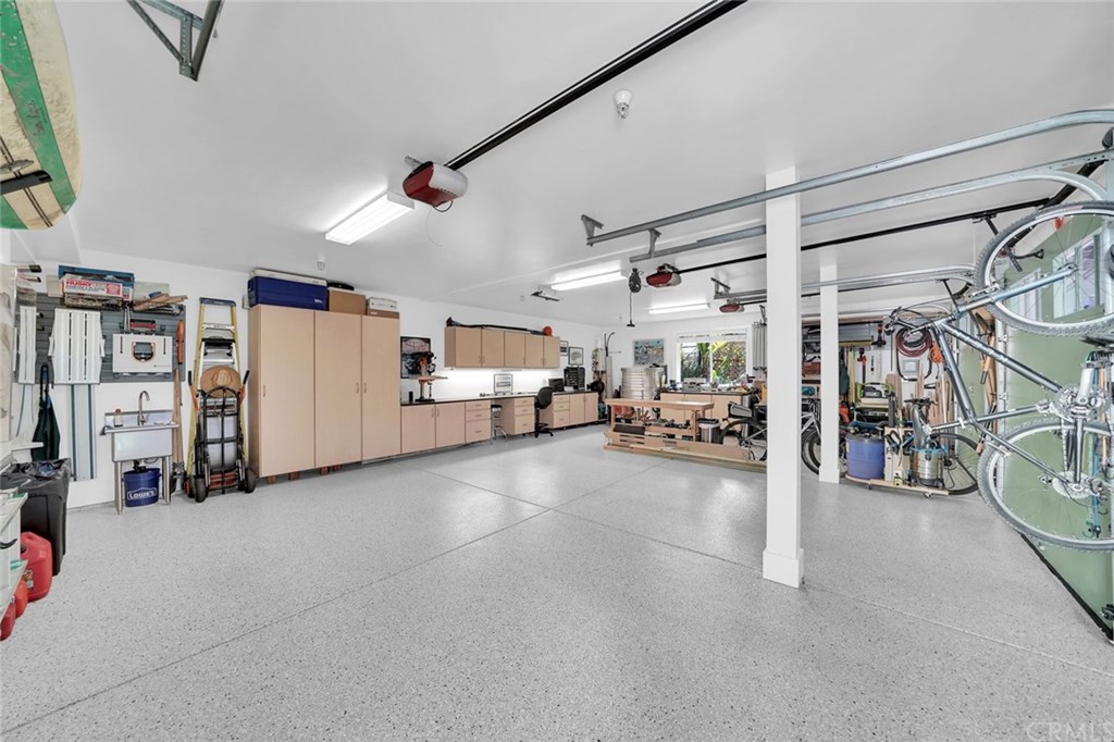 183 La Costa Avenue Encinitas, CA 92024 - Photo 45 of 55 Three car garage with lots of storage plus generator. Tankless hot water heater serves Studio apartment