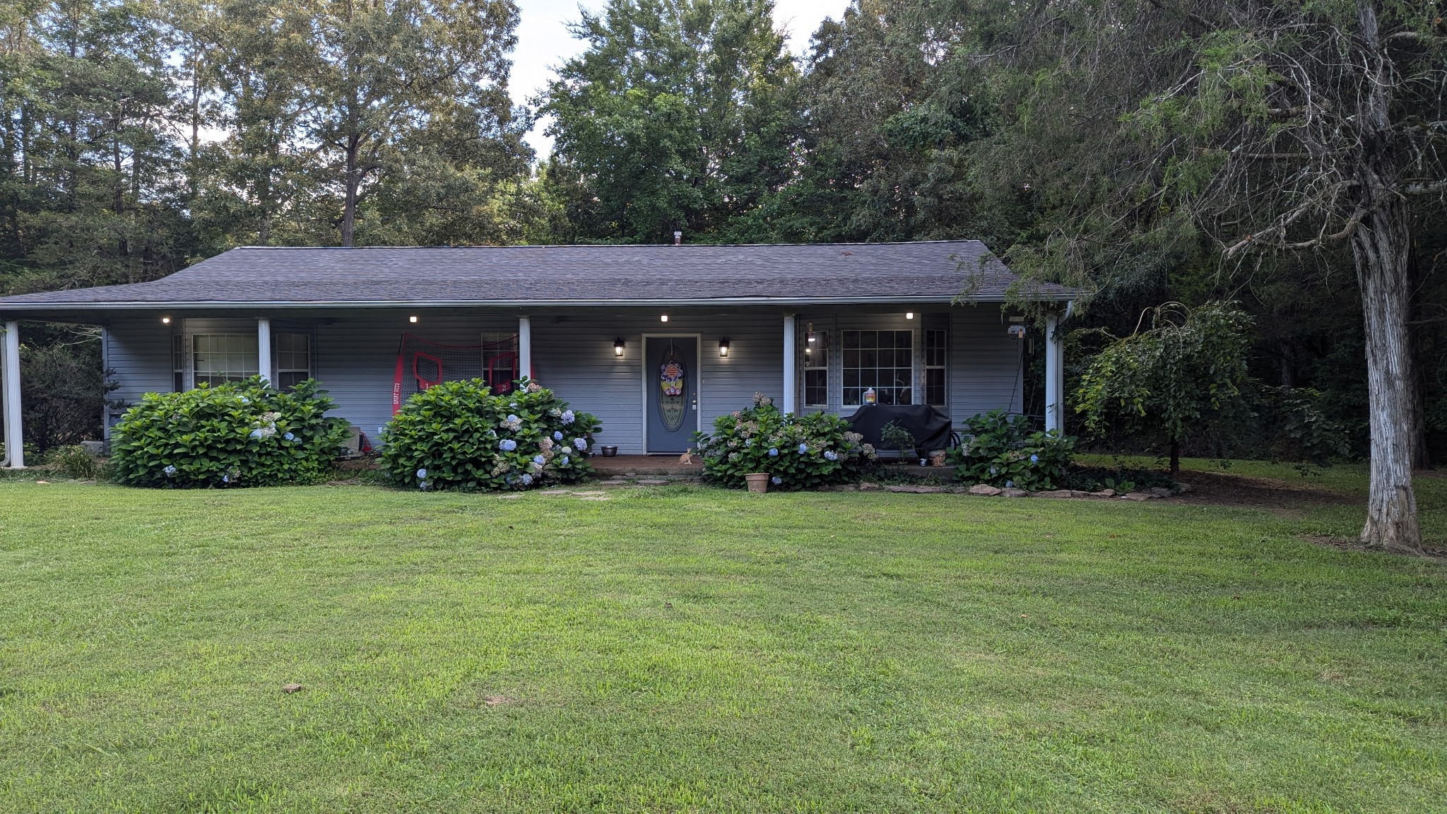 a front view of a house with garden