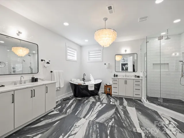 a large room with lots of counter space and a chandelier